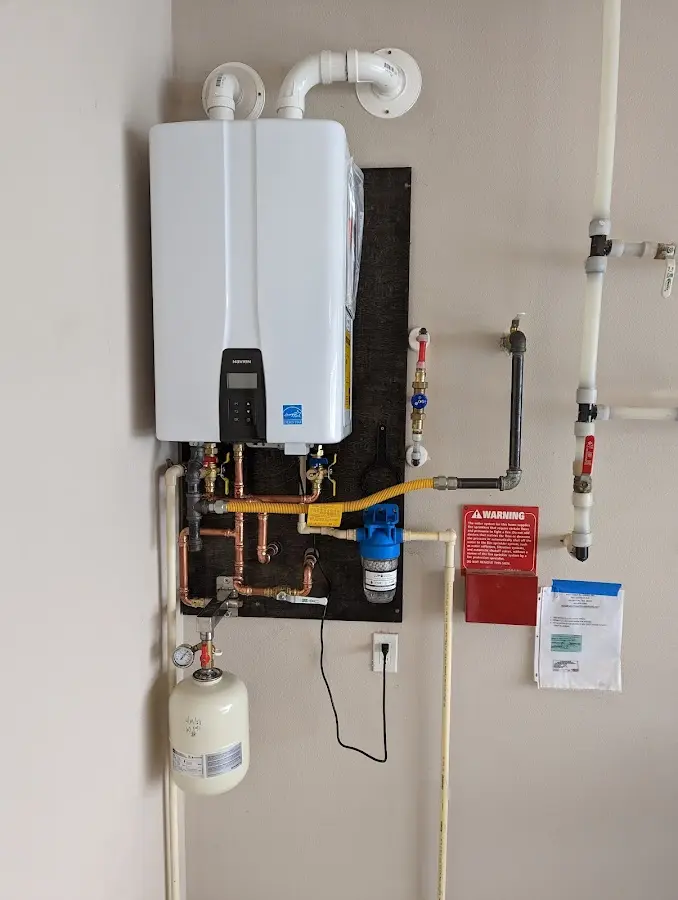 Professional plumber installing copper piping in a Wharton home